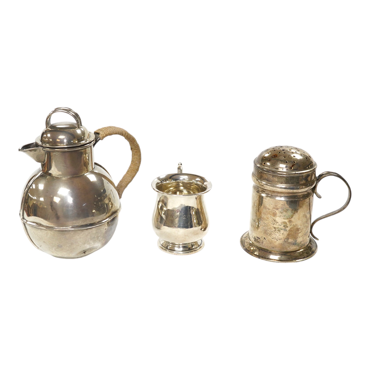 A late Victorian silver Guernsey milk can, marks rubbed, 14cm, a small silver mug and a Scottish silver kitchen pepper, Hamilton & Inches, Edinburgh, 1898, gross weight 16.4 oz. Condition - poor to fair